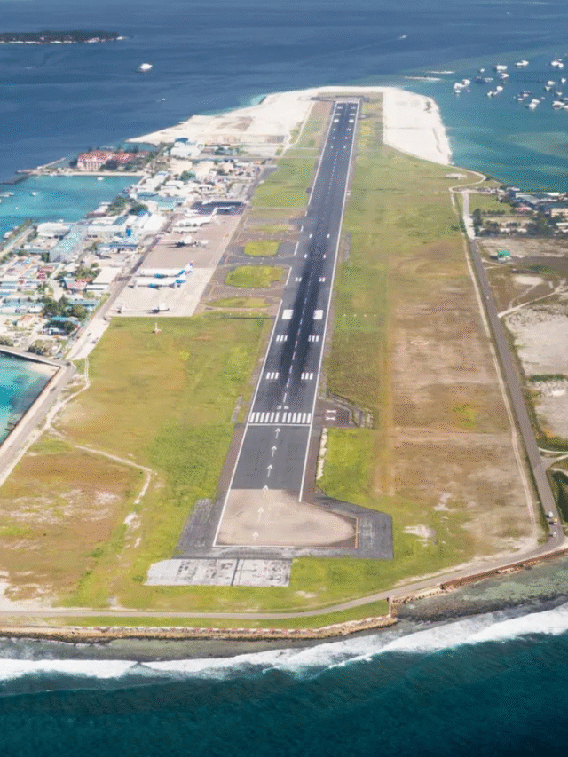 modern aerial view of Velana airport terminal and runway by the sea
